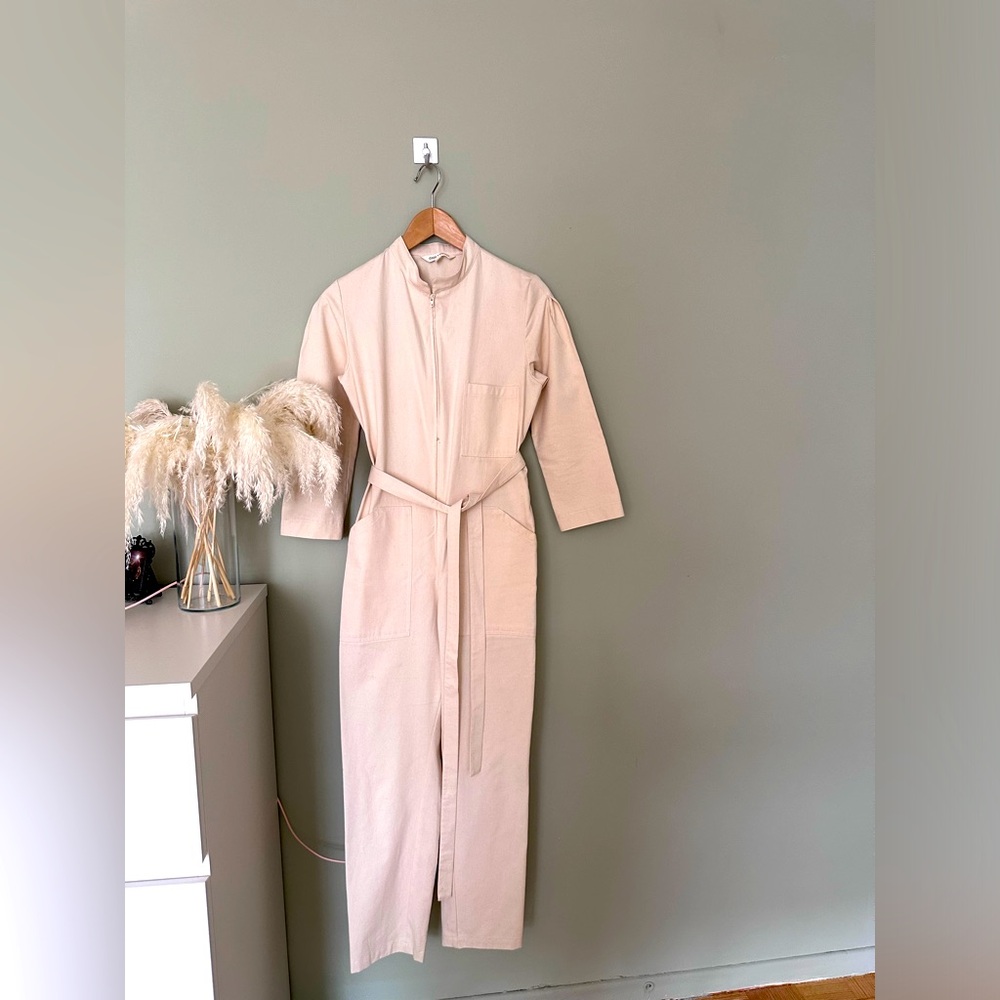 One piece Jumper with belt.